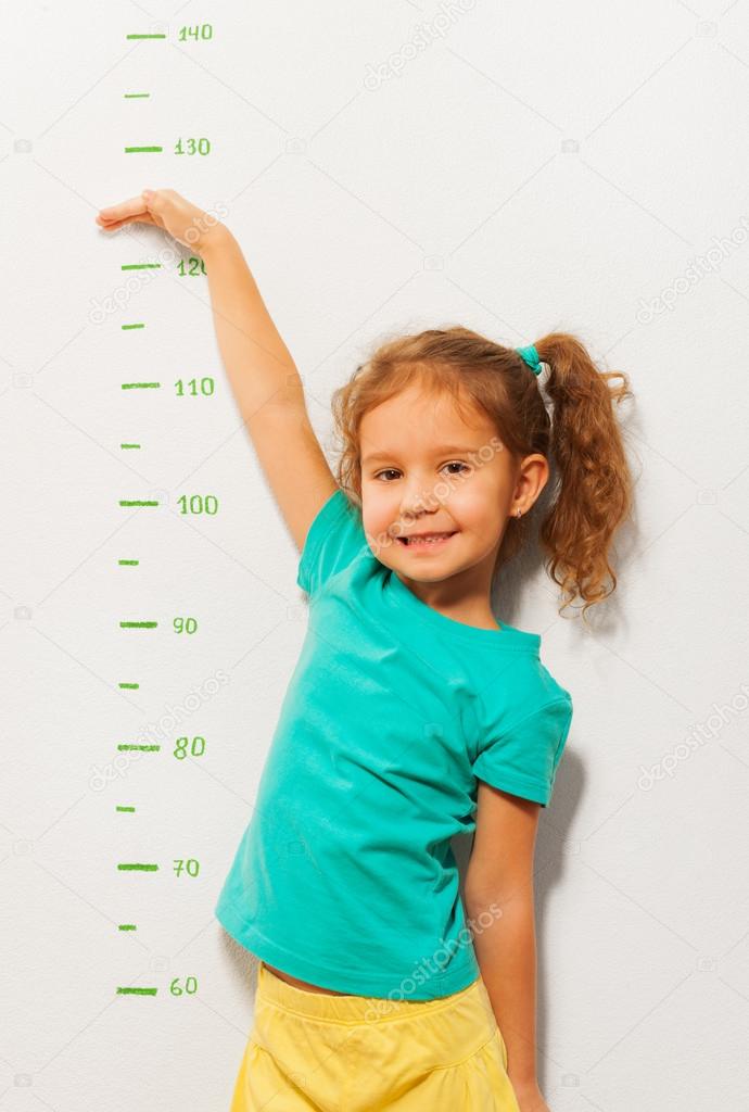 Little girl show how high she will be soon