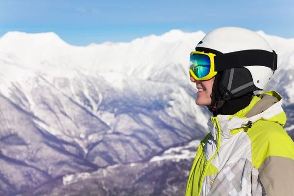 Portrait of skier woman over mountain peaks — Stock Photo, Image