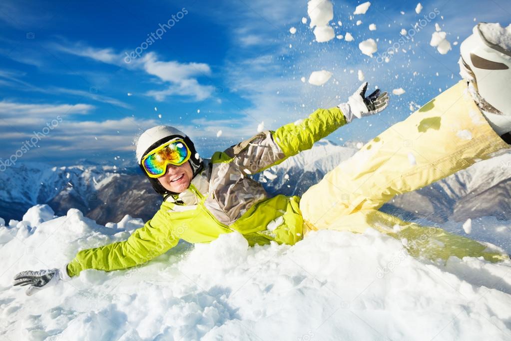 Happy skier woman jump in and throw snow