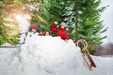 Children playing snowballs clipart