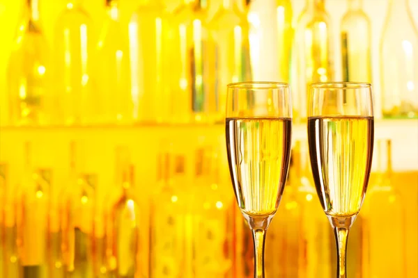 champagne on a yellow bar background