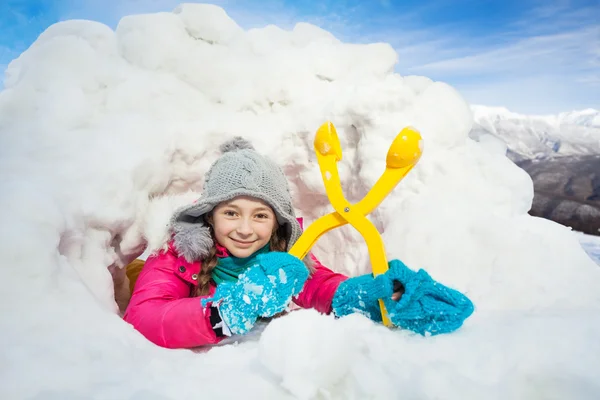 Happy girl with yellow snowmaker — Stock Photo, Image