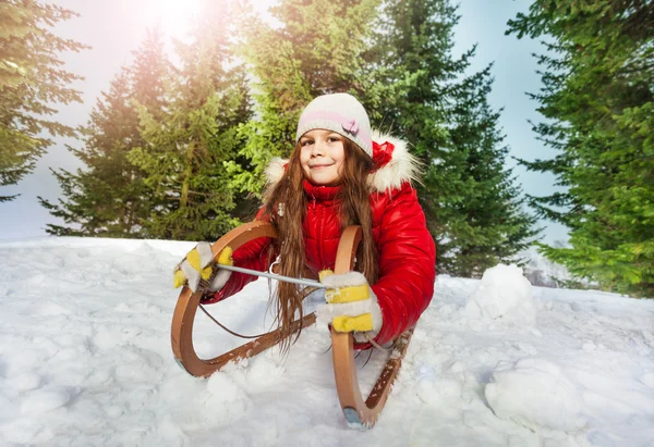 Girl  on snow sledge — Stock Photo, Image