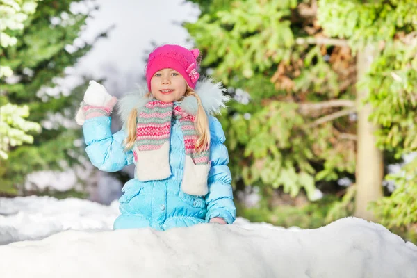 Girl stands hiding in snow — Stock Photo, Image