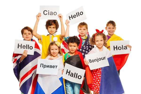 Kids with signs in different languages — Stock Photo, Image