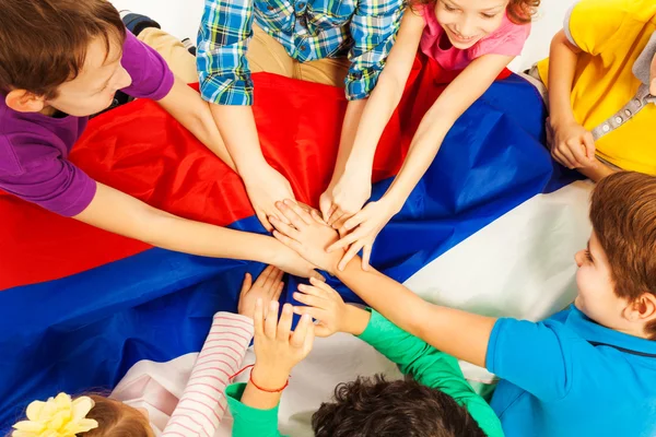 Kids holding their hands together — Stock Photo, Image