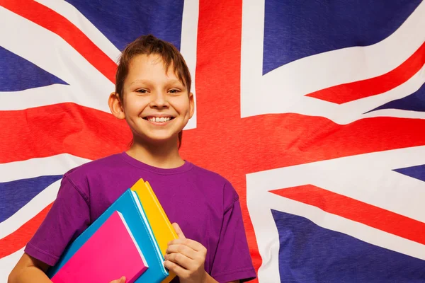 Heureux étudiant anglais avec des manuels scolaires — Photo