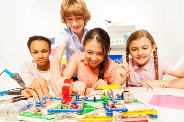 Teenage students making a physical test — Stock Photo, Image