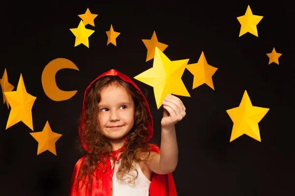 Little dreamer holding shooting star — Stock Photo, Image