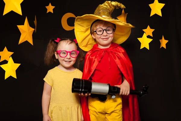Boy and girl in stargazers costumes — Stock Photo, Image