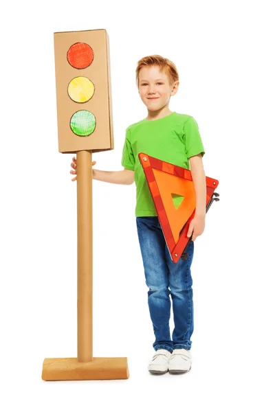 Boy holding warning triangle — Stock Photo, Image