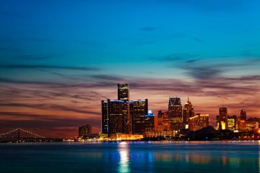 Night view of Detroit river and city downtown from sunset point of Belle Isle, Michigan USA clipart