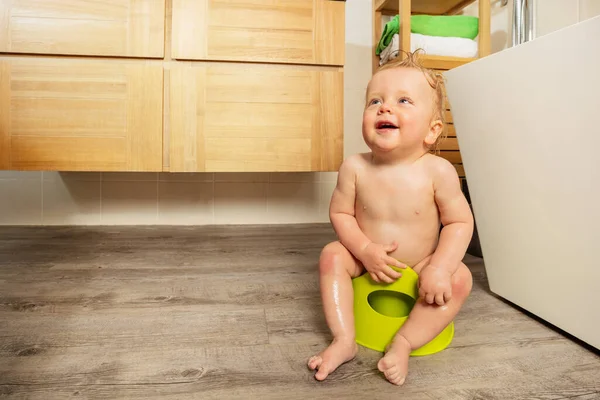 stock image Little toddler boy learns to sit early on a potty - portrait in the bathroom