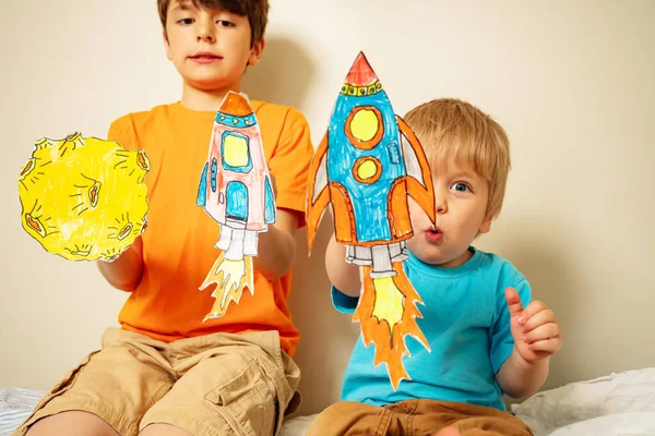 Two Boys Play Astronauts Holding Paper Rockets Planets Home — Stok fotoğraf