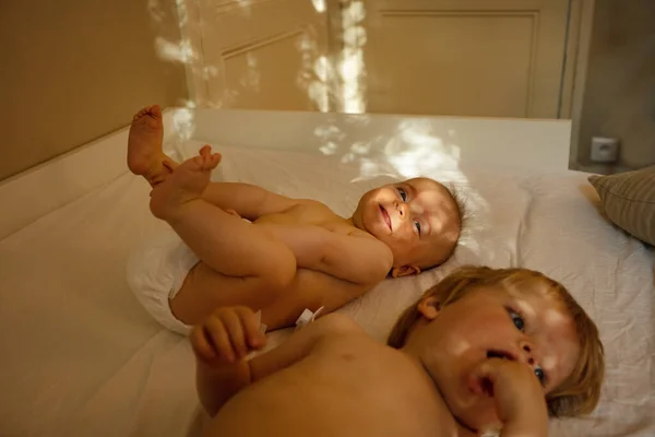 Two Happy Babies Lay Bed Home Environment Contrast Morning Light — Stockfoto