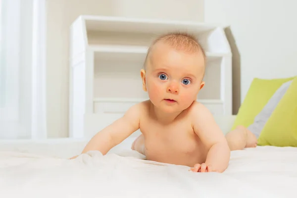 Calm Beautiful Baby Girl Standing Hands Bed Looking Camera Big — Stockfoto