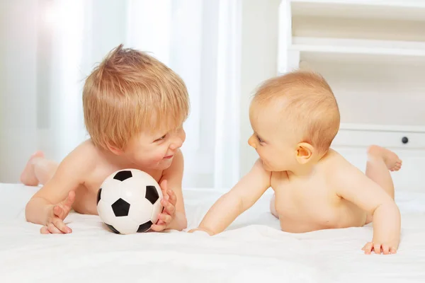 Two Happy Babies Boy Small Girl Lay Football Ball Looking — Stock Photo, Image