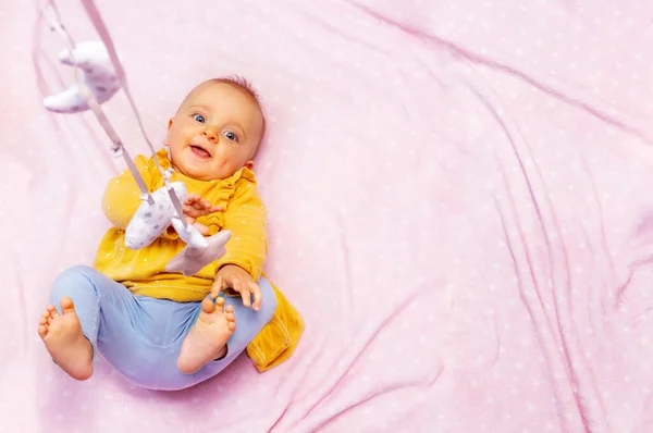 Cute Little Baby Girl Play Mobile Toys View Pink Blanket — Φωτογραφία Αρχείου