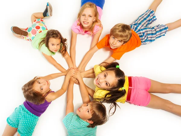 Many kids laying on floor — Stock Photo, Image