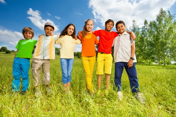 Happy kids standing in a row straight Royalty Free Stock Photos