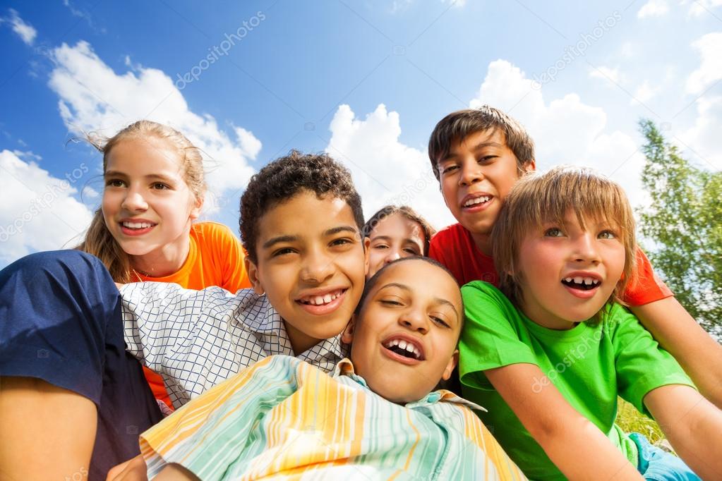 Happy smiling kids sitting in hug