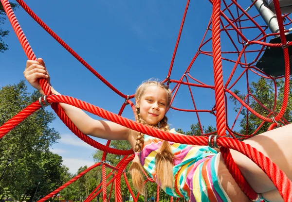 Active girl on red ropes — Stock Photo, Image