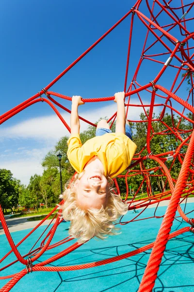 Active boy on red rope — Stock Photo, Image