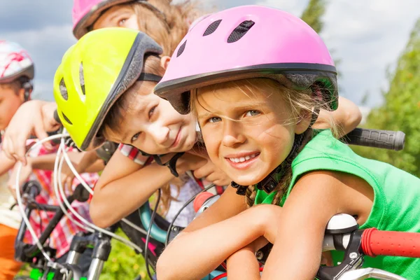 Blond girl and boy in helmet — Stock Photo, Image