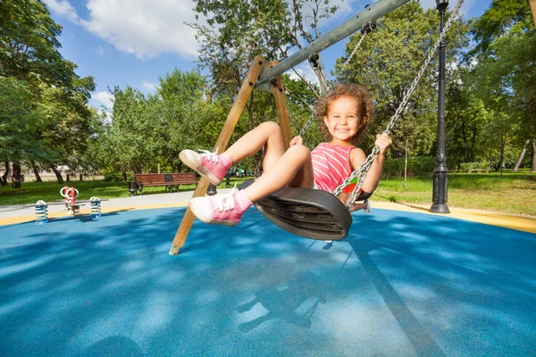 Nice little girl swinging — Stock Photo, Image