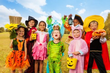 Happy excited kids in Halloween costumes clipart