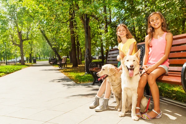 Two girls with dogs — Stock Photo, Image