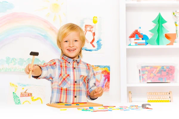 Blond boy plays with game — Stock Photo, Image