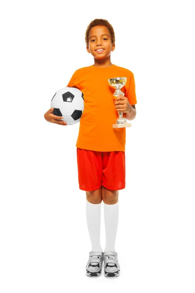 Boy holding soccer ball and prize — Stock Photo, Image