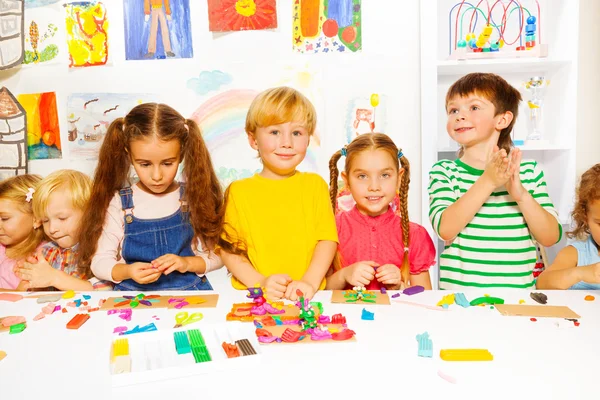Kids play with modeling clay — Stock Photo, Image