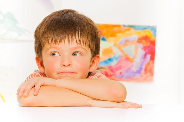 Little boy laying on table — Stock Photo, Image