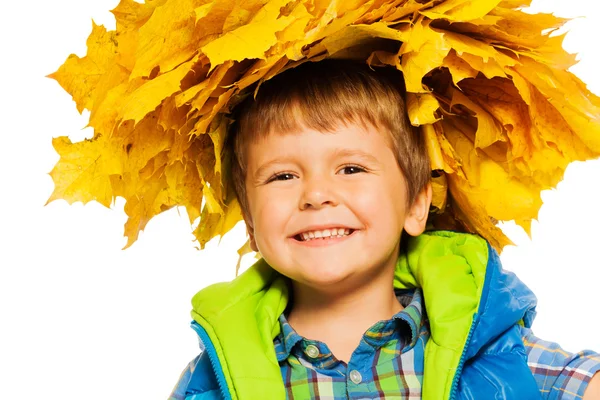 Boy in wreath of maple leaves — Stock Photo, Image