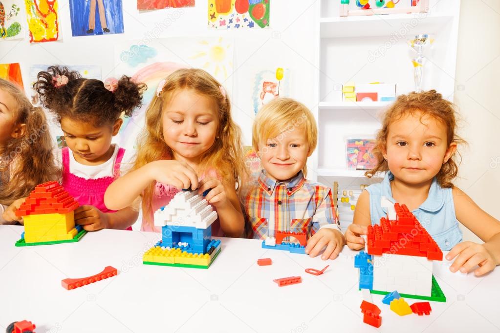 Kids playing with plastic blocks