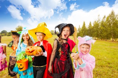 Kids wearing Halloween costumes clipart
