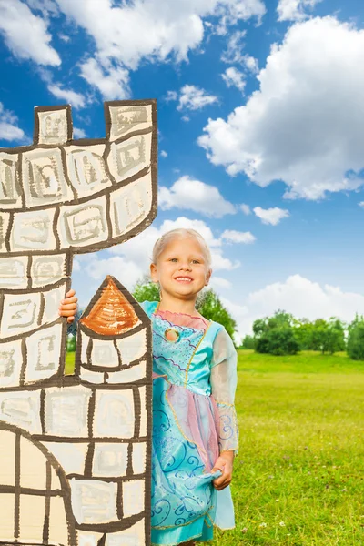 Princess stands behind tower — Stock Photo, Image
