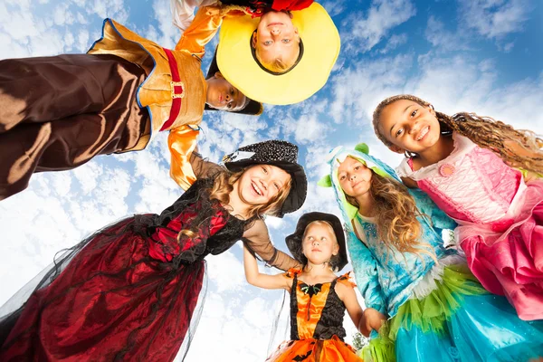 Kids looking down in costumes — Stock Photo, Image