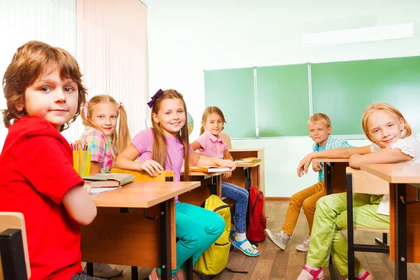 Desk rows with children — Stock Photo, Image