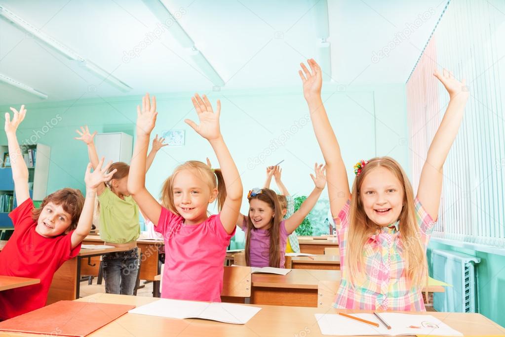 Happy kids with arms up