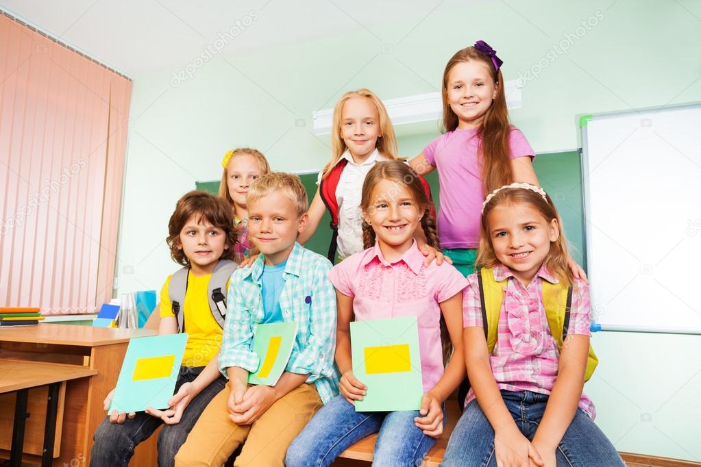 Schoolchildren sitting with textbooks