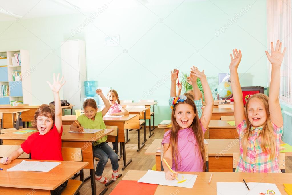 Happy children with arms up