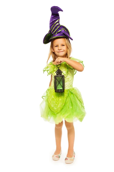 Girl in Halloween costume with lantern — Stock Photo, Image