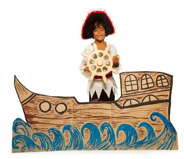 Boy pirate on cardboard ship — Stock Photo, Image