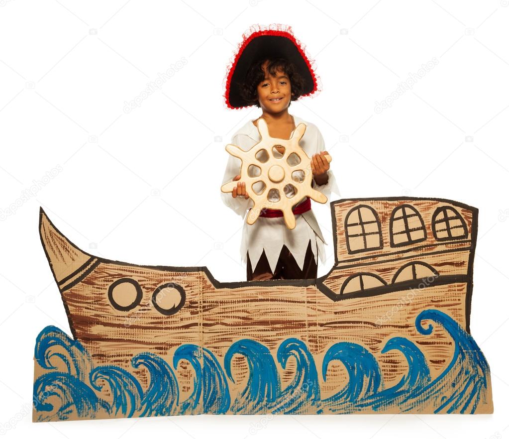 Boy pirate on cardboard ship