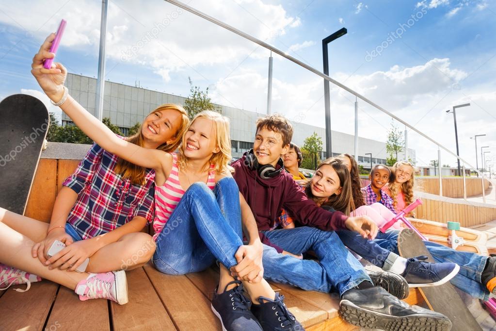 Blond girl making selfie