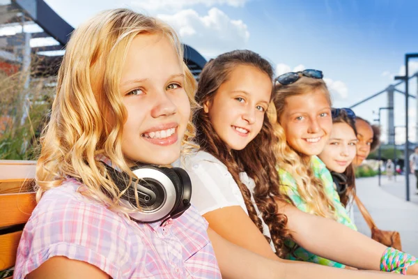 Blond girl and her friends — Stock Photo, Image