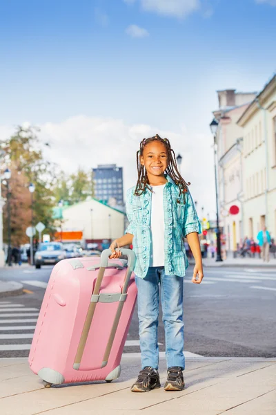 African girl holding luggage — Stock Photo, Image